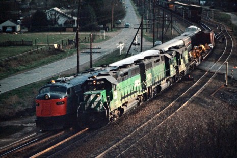 Northbound Burlington Northern Railroad freight train and Amtrak passenger train near Longview, Washington, on April 13, 1975. Photograph by John F. Bjorklund, © 2015, Center for Railroad Photography and Art. Bjorklund-08-27-01