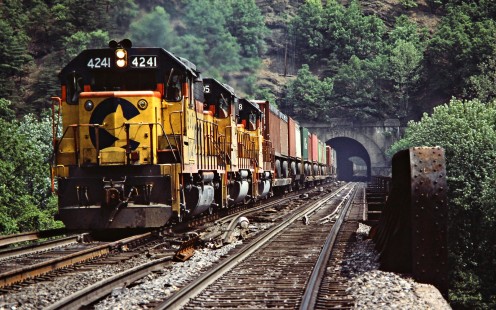 Westbound Baltimore and Ohio Railroad freight train crossing the bridge over the Potomac River in Paw Paw, West Virginia, on May 26, 1984. Photograph by John F. Bjorklund, © 2015, Center for Railroad Photography and Art. Bjorklund-17-12-10