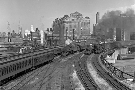 Chicago & North Western commuter trains led by 4-6-2 steam locomotives on the big curve just north of the the North Western Terminal in Chicago in the 1950s. Photograph by Wallace W. Abbey, © 2015, Center for Railroad Photography and Art. Abbey-02-070-02