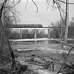 Eastbound New York Central Railroad <i>Southwestern Limited</i> passenger train no. 11 crosses frozen Embarras River near Charleston, Illinois, in January 1959. Photograph by J. Parker Lamb, © 2015, Center for Railroad Photography and Art. Lamb-01-066-06