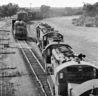 Lead unit of Atchison, Topeka and Santa Fe Railway sulfur train passes CF-7 locomotive on local freight train at Belton, Texas, in July 1977. Photograph by J. Parker Lamb, © 2016, Center for Railroad Photography and Art. Lamb-02-068-06