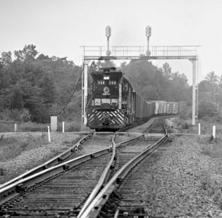After Southern Railway northbound train has cleared, southbound freight led by SD45 no. 3168 leaves siding south of Danville, Virginia, in May 1965. Photograph by J. Parker Lamb, © 2016, Center for Railroad Photography and Art. Lamb-01-083-12