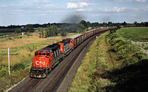 Westbound Canadian National Railway freight train in Hyde Park, Ontario, on August 30, 1986. Photograph by John F. Bjorklund, © 2015, Center for Railroad Photography and Art. Bjorklund-22-14-03