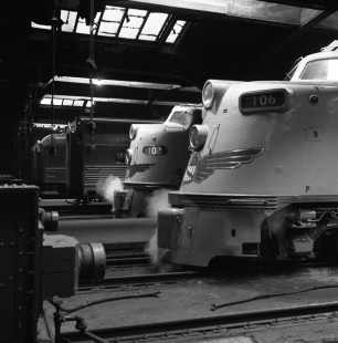 Two Union Pacific streamlined passenger trains from the West Coast rest at the North Western Terminal in Chicago on November 2, 1951. No. 102 is the eastbound <i>City of San Francisco</i> and no. 106 is the eastbound <i>City of Portland</i>. At the time, Union Pacific trains used the Chicago & North Western Railway between Omaha and Chicago. Photograph by Wallace W. Abbey, © 2015, Center for Railroad Photography and Art. Abbey-01-077-10