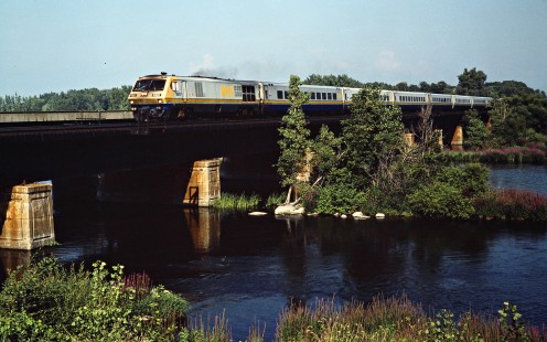 Westbound VIA Rail passenger train on the Canadian National Railway in Dorian, Quebec, on August 17, 1986. Photograph by John F. Bjorklund, © 2015, Center for Railroad Photography and Art. Bjorklund-22-02-16