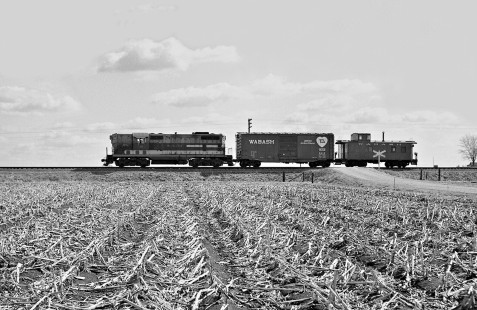 "Not much tonnage but quite picturesque." Wabash Railroad local freight train, bound for Danville, passing Sidney, Illinois, with one freight car on April 7, 1960. Photograph by J. Parker Lamb, © 2015, Center for Railroad Photography and Art. Lamb-01-036-08