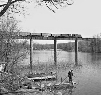 Eastbound Pennsy reefer train (from Toledo, Peoria and Western Railway) crosses Tippecanoe River at Monticello, Indiana, on April 4, 1959. Photograph by J. Parker Lamb, © 2015, Center for Railroad Photography and Art. Lamb-01-065-07