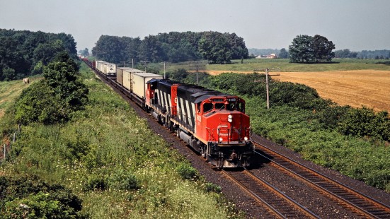 Eastbound Canadian National Railway freight train in Hyde Park, Ontario, on July 20, 1991. Photograph by John F. Bjorklund, © 2015, Center for Railroad Photography and Art. Bjorklund-23-01-13