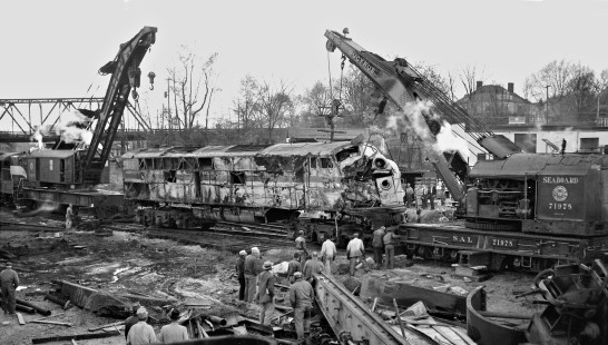 On April 8, 1961, northbound Seaboard Air Line Railroad mail-express train no. 8 derailed in downtown Raleigh, North Carolina. The wreck occurred around 11am in, but it was past sunset when the wrecker crews lifted the E7 locomotive carbody back onto its trucks for the trip to Hamlet yard. Photograph by J. Parker Lamb, © 2016, Center for Railroad Photography and Art. Lamb-01-068-06