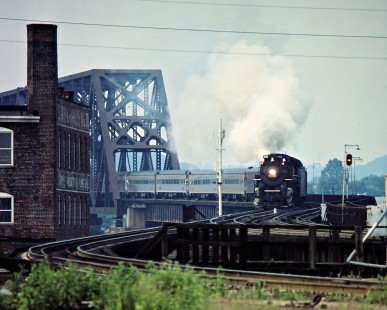 Nickel Plate Road 2-8-4 steam locomotive no. 765 pulling a passenger train across Norfolk Southern's former Southern Railway bridge over the Ohio River in Cincinnati, Ohio, on August 26, 1984. Photograph by John F. Bjorklund, © 2015, Center for Railroad Photography and Art. Bjorklund-17-15-20