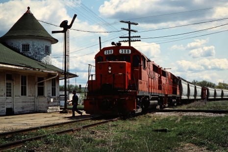 Northbound Ann Arbor Railroad freight train crossing the Chessie System's former Pere Marquette line at the depot in Clare, Michigan, on May 14, 1984. Photograph by John F. Bjorklund, © 2015, Center for Railroad Photography and Art. Bjorklund-03-08-12