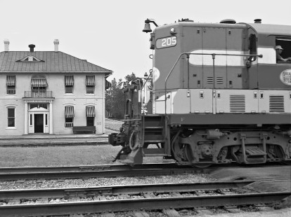 Aberdeen and Rockfish Railroad Geep passes the road's general office building in downtown Aberdeen, North Carolina, in April 1961. Photograph by J. Parker Lamb, © 2016, Center for Railroad Photography and Art. Lamb-01-094-08