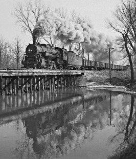 Illinois Central Railroad's northbound Thebes Turn local freight train rumbles over a tresle south of Murphysboro, Illinois, behind 2-8-2 steam locomotive no. 1537 on January 29, 1959. Photograph by J. Parker Lamb, © 2015, Center for Railroad Photography and Art. Lamb-01-028-07