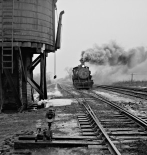 Bevier & Southern Railroad Mogul no. 112 passes tank as crew heads for shop at Bevier, Missiouri, in January 1959. Photograph by J. Parker Lamb, © 2015, Center for Railroad Photography and Art. Lamb-01-050-05