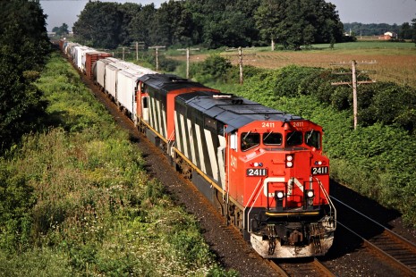 Eastbound Canadian National Railway freight train in Komoka, Ontario, on August 17, 1992. Photograph by John F. Bjorklund, © 2015, Center for Railroad Photography and Art. Bjorklund-23-02-19