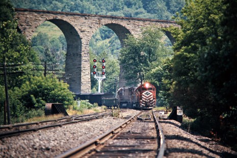 Northbound Delaware and Hudson Railway freight train with Lehigh Valley locomotives under the Starrucca Viaduct in Lanesboro, Pennsylvania, on July 22, 1975. Photograph by John F. Bjorklund, © 2015, Center for Railroad Photography and Art. Bjorklund-18-16-23