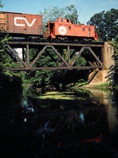 Southbound Ann Arbor Railroad caboose at Shiawassee River in Byron, Michigan, on August 14, 1982. Photograph by John F. Bjorklund, © 2015, Center for Railroad Photography and Art. Bjorklund-02-26-17