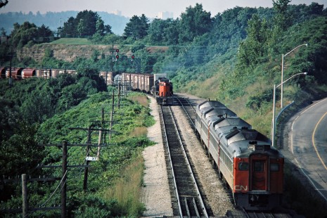 Eastbound Canadian National Railway freight train passing an RDC passenger train at in Hamilton, Ontario, on August 16, 1975. Photograph by John F. Bjorklund, © 2015, Center for Railroad Photography and Art. Bjorklund-20-07-17