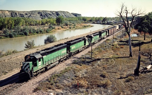 Westbound Burlington Northern Railroad freight train next to Big Horn River in Greybull, Wyoming, on October 2, 1984. Photograph by John F. Bjorklund, © 2015, Center for Railroad Photography and Art. Bjorklund-13-02-11