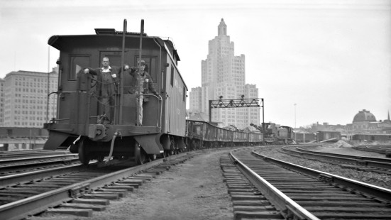 New York, New Haven and Hartford work train with caboose no. C-529, two crew members standing on rear platform, entering Union Station in Providence, Rhode Island, some time between 1950 and 1955. Photograph by Leo King, © 2016, Center for Railroad Photography and Art. King-01-003-002