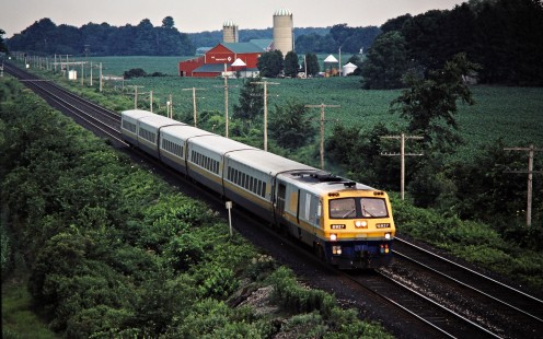 Eastbound VIA Rail passenger train on the Canadian National Railway in Strathroy, Ontario, on June 27, 1987. Photograph by John F. Bjorklund, © 2015, Center for Railroad Photography and Art. Bjorklund-22-20-11