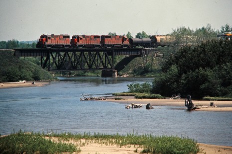 Westbound Ann Arbor Railroad freight train at Manistee River in Mesick, Michigan, on June 5, 1976. Photograph by John F. Bjorklund, © 2015, Center for Railroad Photography and Art. Bjorklund-03-19-01