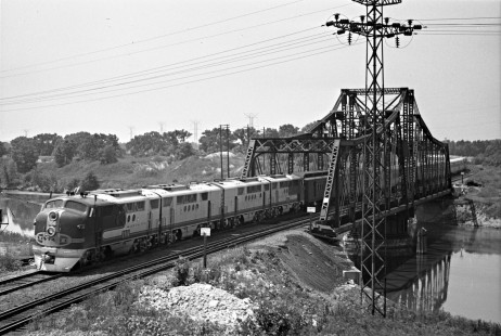 Santa Fe Railway passenger train "First 20," the first section of the eastbound <i>Chief</i>, comes across Bridge 9C east of McCook behind FT diesel no. 164 on July 28, 1946. Photograph by Wallace W. Abbey, © 2015, Center for Railroad Photography and Art. Abbey-02-062-03