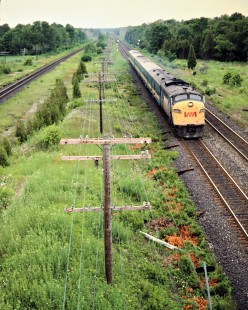 Eastbound VIA Rail passenger train on the Canadian National Railway in Coburg, Ontario, on July 7, 1985. Photograph by John F. Bjorklund, © 2015, Center for Railroad Photography and Art. Bjorklund-21-24-06