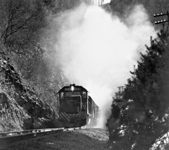 Northbound Clinchfield Railroad train creates giant plume as it exits Second Rocky Tunnel tunnel on the "Loops" near Altapass, North Carolina, in August 1966. Photograph by J. Parker Lamb, © 2016, Center for Railroad Photography and Art. Lamb-01-089-08