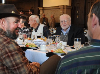 Crowd gathers at Friday night's welcome dinner, including <i>Railfan & Railroad</i> editor Steve Barry (left) and Greg Molloy (center). Center for Railroad Photography and Art. Photograph by Henry A. Koshollek