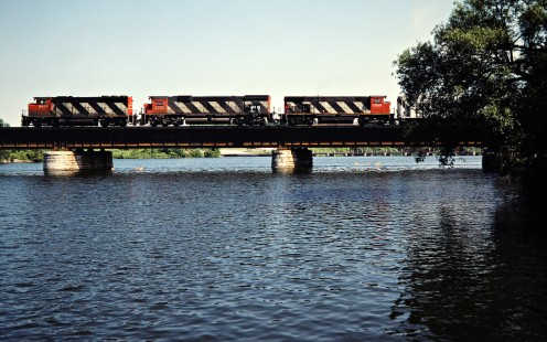 Eastbound Canadian National Railway freight train in Trenton, Ontario, on July 4, 1985. Photograph by John F. Bjorklund, © 2015, Center for Railroad Photography and Art. Bjorklund-21-22-06