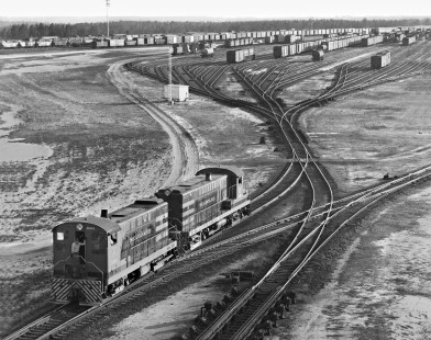 Southward view of Seaboard Air Line Railroad's classification yard hump and bowl in Hamlet, North Carolina, with arrival/departure yards in background in August 1961. Photograph by J. Parker Lamb, © 2016, Center for Railroad Photography and Art. Lamb-01-078-03