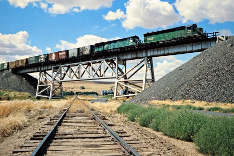 Eastbound Burlington Northern Railroad freight train crossing UP Connell Branch in Washtucna, Washington, on August 16, 1978. Photograph by John F. Bjorklund, © 2015, Center for Railroad Photography and Art. Bjorklund-10-07-18