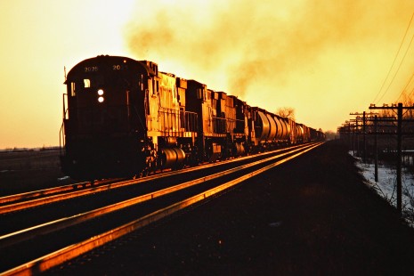 Eastbound Canadian National Railway freight train in Komoka, Ontario, on March 7, 1987. Photograph by John F. Bjorklund, © 2015, Center for Railroad Photography and Art. Bjorklund-22-19-13