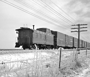Caboose of an eastbound Wabash Railroad freight train traversing the ice-covered landscape near Sidney, Illinois, in February 1960. Photograph by J. Parker Lamb, © 2015, Center for Railroad Photography and Art. Lamb-01-036-03