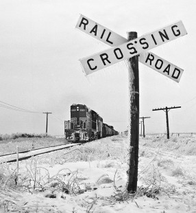 Westbound Peoria and Eastern Railway freight train traverses landscape left by ice-storm near Champaign, Illinois, in January 1959. Photograph by J. Parker Lamb, © 2015, Center for Railroad Photography and Art. Lamb-01-066-03