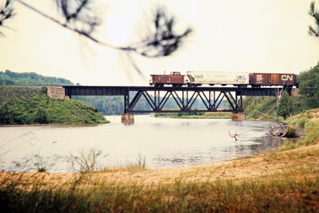 Southbound Ann Arbor Railroad freight train at Manistee River in Mesick, Michigan, on July 10, 1976. Photograph by John F. Bjorklund, © 2015, Center for Railroad Photography and Art. Bjorklund-01-22-02