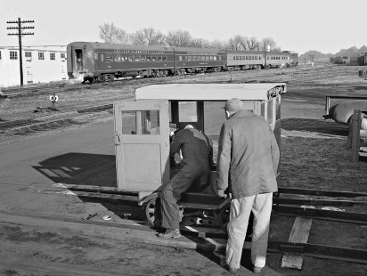 Chicago & Eastern Illinois Railroad northbound <i>Meadowlark</i> passenger train leaving Danville, Illinois, as two track workers examine their speeder in March 1959. Photograph by J. Parker Lamb, © 2015, Center for Railroad Photography and Art. Lamb-01-043-08