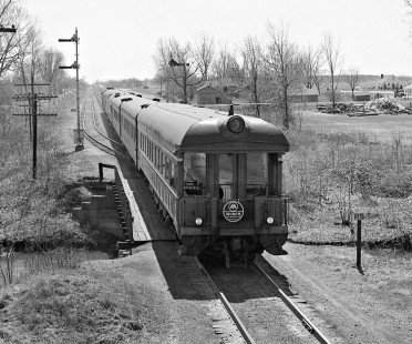 Monon Railroad southbound <i>Thoroughbred</i> passenger train accelerating away from the station at Monon, Indiana, on April 4, 1959. Photograph by J. Parker Lamb, © 2015, Center for Railroad Photography and Art. Lamb-01-045-04