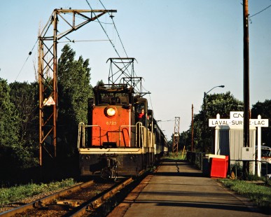 Westbound Canadian National Railway passenger train led by boxcab electric no. 6725 in Laval-sur-le-lac, Quebec, on August 18, 1986. Photograph by John F. Bjorklund, © 2015, Center for Railroad Photography and Art. Bjorklund-22-07-13