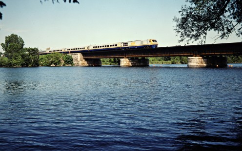 Westbound VIA Rail passenger train on the Canadian National Railway in Trenton, Ontario, on July 4, 1985. Photograph by John F. Bjorklund, © 2015, Center for Railroad Photography and Art. Bjorklund-21-22-02