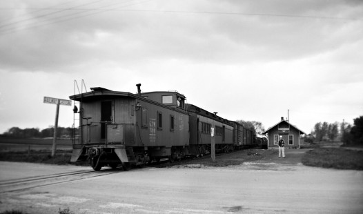Grand Trunk Western Railroad train passes depot at Kingston, Michigan, circa 1955. Photograph by Robert Hadley; Hadley-05-012-04.JPG; © 2017, Center for Railroad Photography and Art