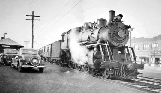 Erie Railroad 4-6-0 steam locomotive no. 956 at station in Montvale, New Jersey, on April 15, 1939. Photograph by Robert A. Hadley, © 2017, Center for Railroad Photography and Art. Hadley-06-132-05