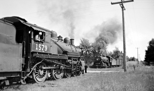 Grand Trunk Western Railroad train no. 52 meets with extra north of Cass City, Michigan, circa 1940. Photograph by Robert Hadley; Hadley-05-013-04.JPG; © 2017, Center for Railroad Photography and Art
