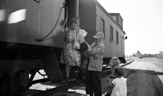Grand Trunk Western Railroad conductor Frank Mapley and unidentified indivdiuals at Romeo , Michigan, circa 1940. Hadley-03-149-04.JPG; © 2016, Center for Railroad Photography and Art