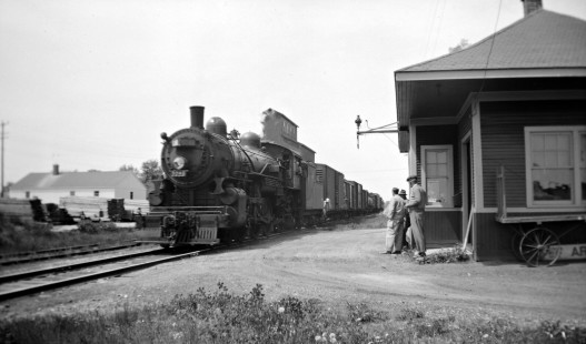 Grand Trunk Western Railroad steam locomotive no. 5046 hauls freight in Armada, Michigan, in 1939; Photograph by Robert Hadley. Hadley-03-148-03.JPG; © 2016, Center for Railroad Photography and Art