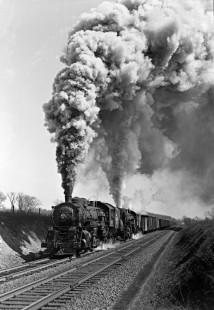 Erie Railroad 2-8-2 steam locomotives nos. 3095 and 3143 pulling a westbound freight train at Michigan Corners, New York, on March 28, 1943. Photograph by Donald W. Furler, © 2017, Center for Railroad Photography and Art, Furler-10-054-01
