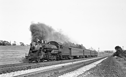 Delaware, Lackawanna, and Western Railroad 4-4-0 steam locomotive no. 964 leads westbound passenger train in Clifton, New Jersey, on June 26, 1946. Photograph by Donald Furler. Furler-11-082-01.JPG; © 2017, Center for Railroad Photography and Art