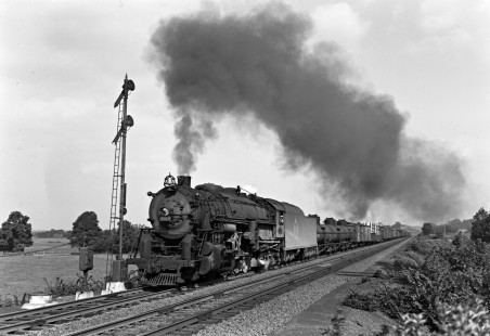 Erie Railroad 2-8-4 steam locomotive no. 3319 pulling a westbound freight train that originated in Maybrook Yard past a semaphore signal at Michigan Corners, New York, on August 30, 1942. Photograph by Donald W. Furler, © 2017, Center for Railroad Photography and Art, Furler-11-005-01