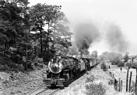 Delaware, Lackawanna and Western Railroad 2-8-2 steam locomotive no. 1256 and Lehigh and Hudson River Railway 2-8-2 steam locomotive no. 80 lead Maybrook to Port Morris freight train on the DLW Sussex Branch near Andover, New Jersey, on June 12, 1949.  Furler-11-110-02.JPG; © 2017, Center for Railroad Photography and Art